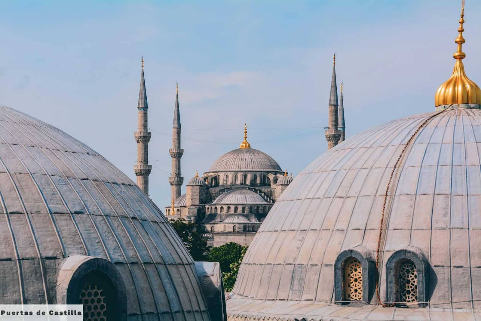 a group of domes with a sky background
